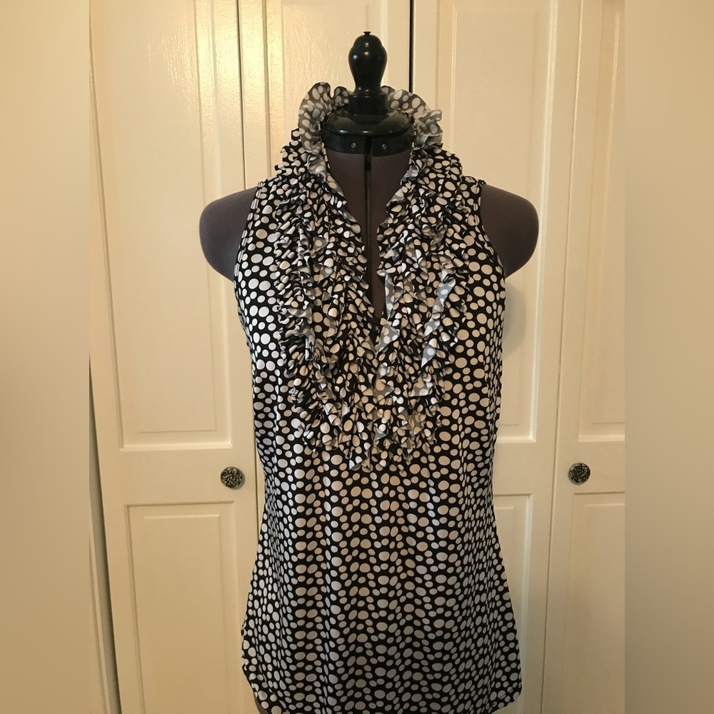 Blacks and white sleeveless pullover top with ruffles. Size S